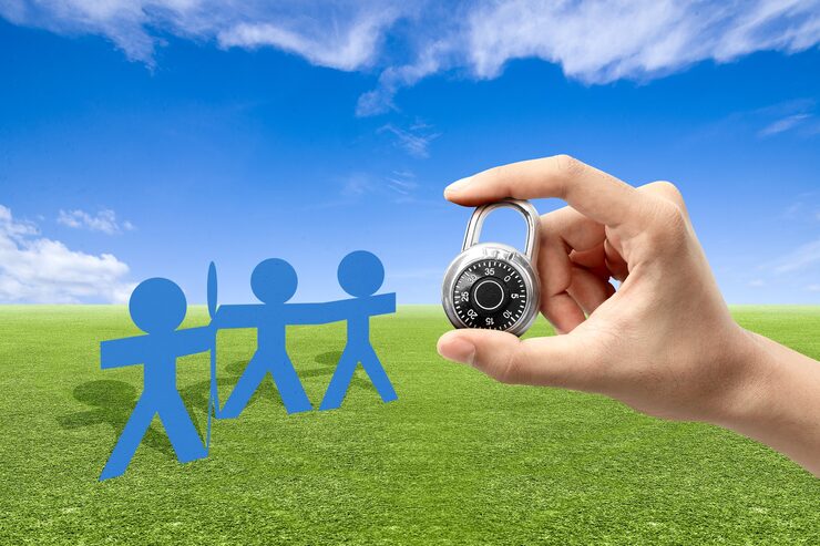 human-hand-holding-padlock-with-blue-sky-background_9083-6667